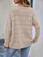 Crew-neck pullover sweater with drop shoulders and loose, relaxed fit for casual all-season wear