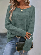 Crew-neck pullover sweater with drop shoulders and loose, relaxed fit for casual all-season wear