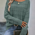 Crew-neck pullover sweater with drop shoulders and loose, relaxed fit for casual all-season wear