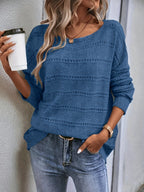 Crew-neck pullover sweater with drop shoulders and loose, relaxed fit for casual all-season wear