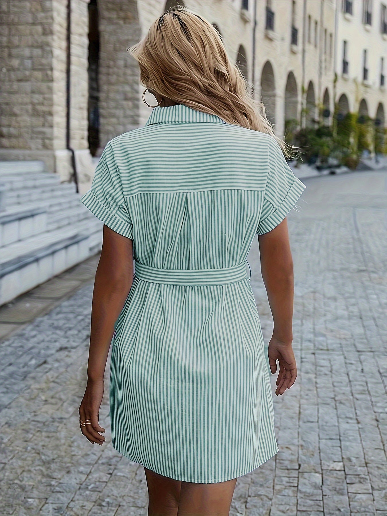 Striped shift dress with ruffle detail, perfect for casual all-season wear.