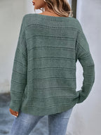 Crew-neck pullover sweater with drop shoulders and loose, relaxed fit for casual all-season wear